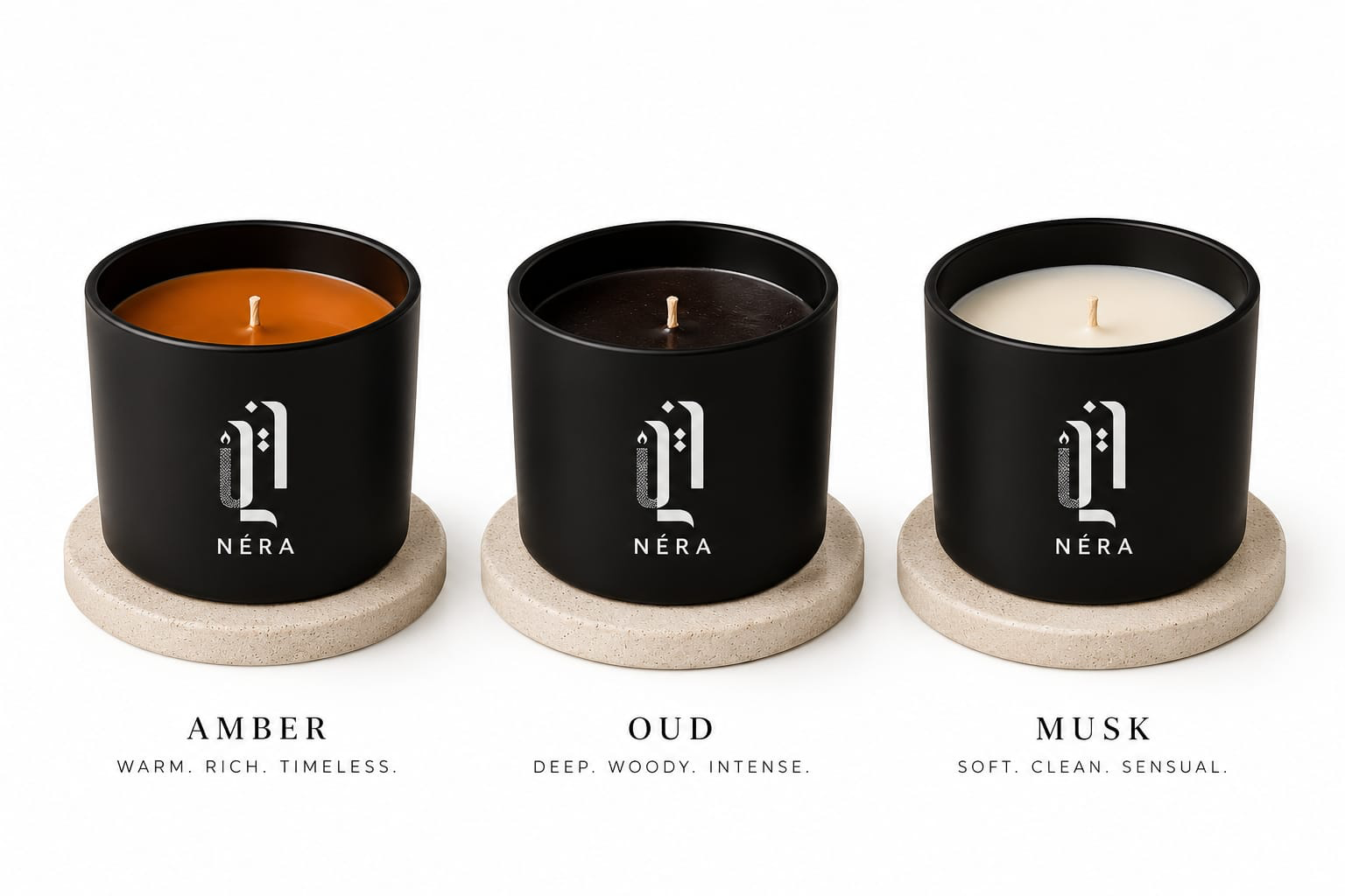 NÉRA Classic Collection, three black candles in Amber, Oud and Musk on stone coasters
