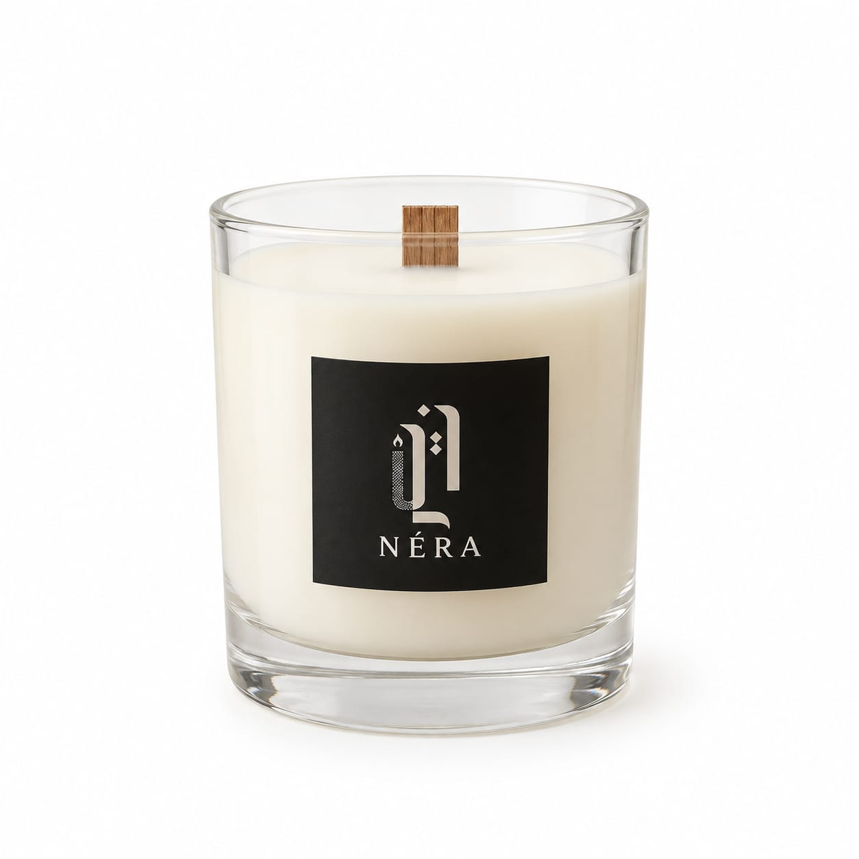 NÉRA Signature Glass candle, a clear glass jar candle with a wooden wick and black NÉRA label