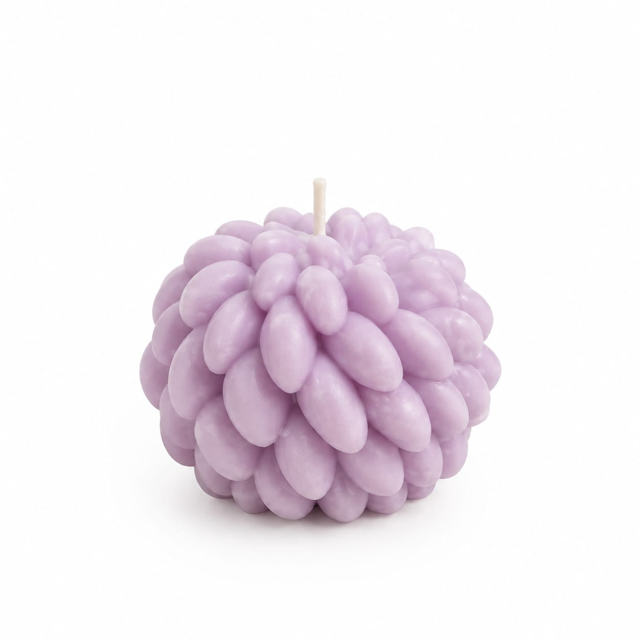 NÉRA Bloom Ball candle, a lavender-purple round candle with delicate petal-like texture