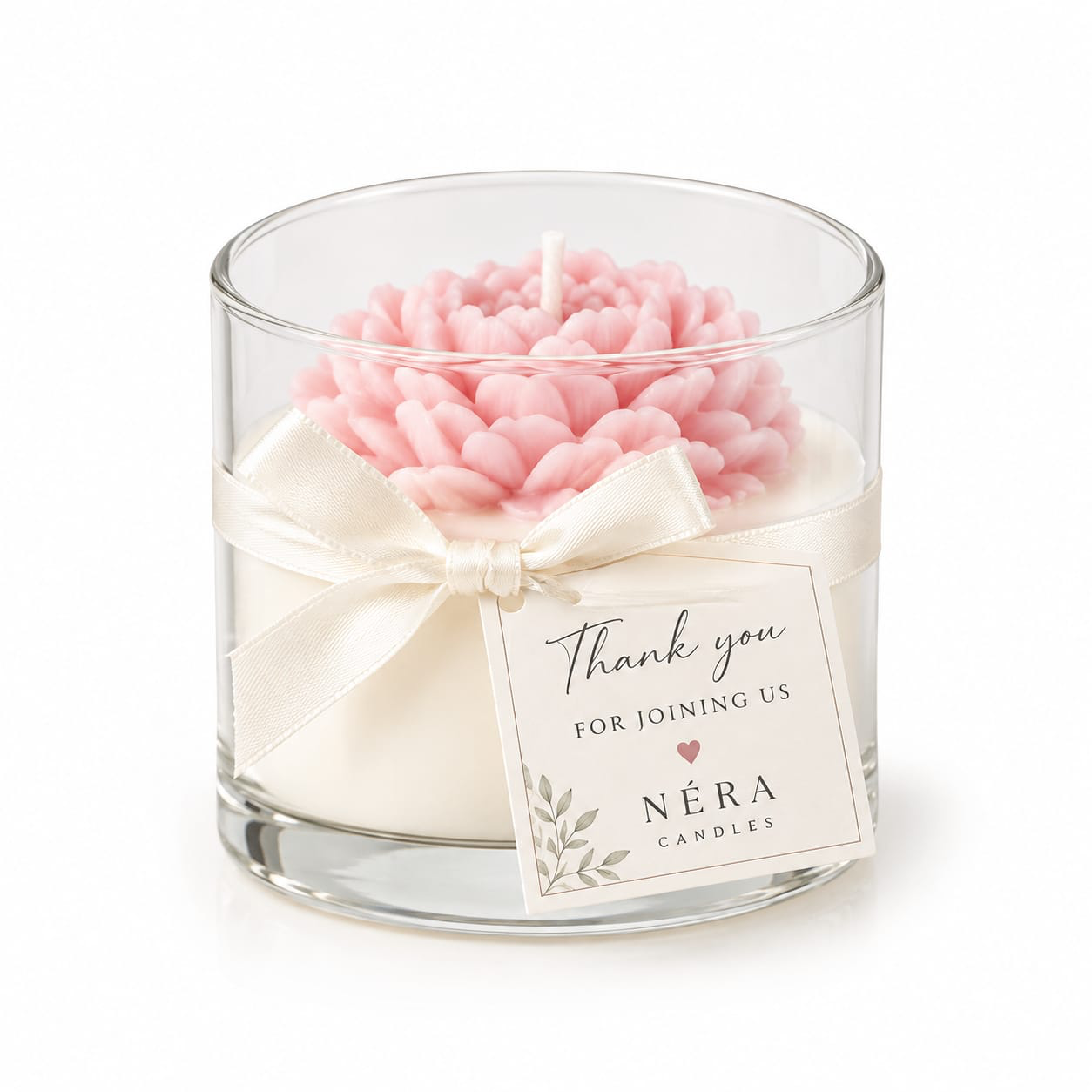 NÉRA floral candle favor with a pink sculpted flower in a glass jar, finished with a cream ribbon and a Thank you for joining us tag