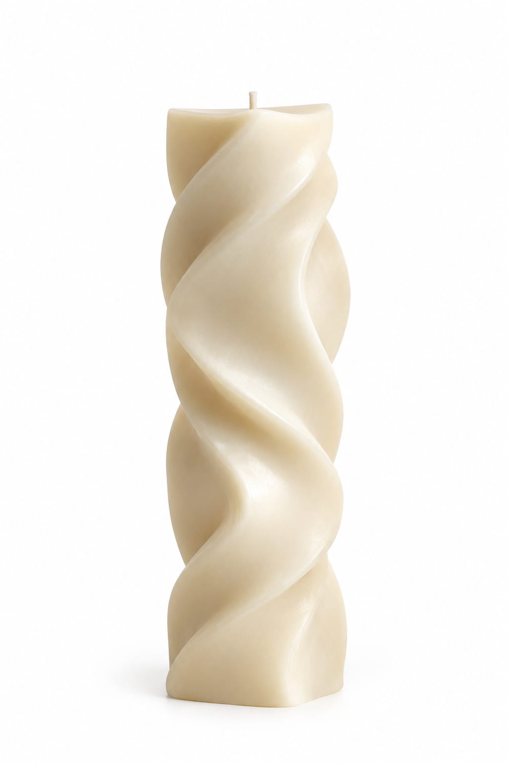 NÉRA Geometric Spiral pillar candle in creamy ivory wax with a flowing twisted spiral design